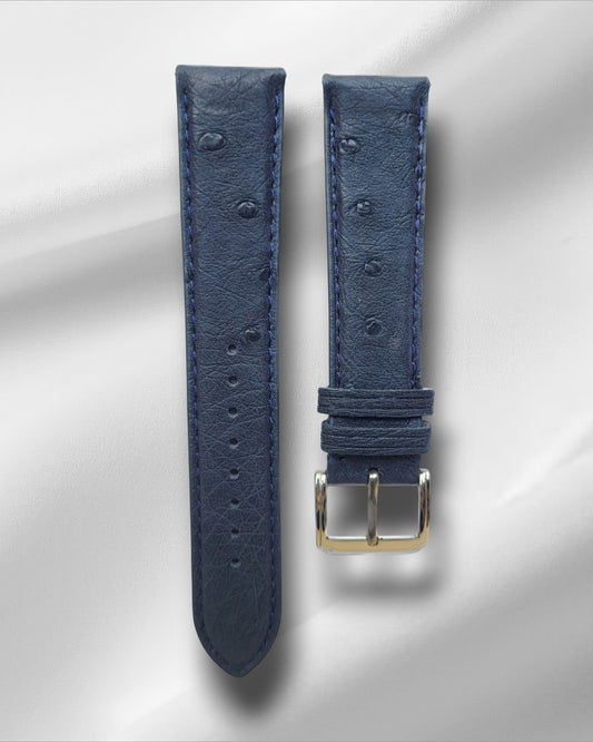 A blue ostrich leather watch strap with a steel tang buckle and quick release spring bars.