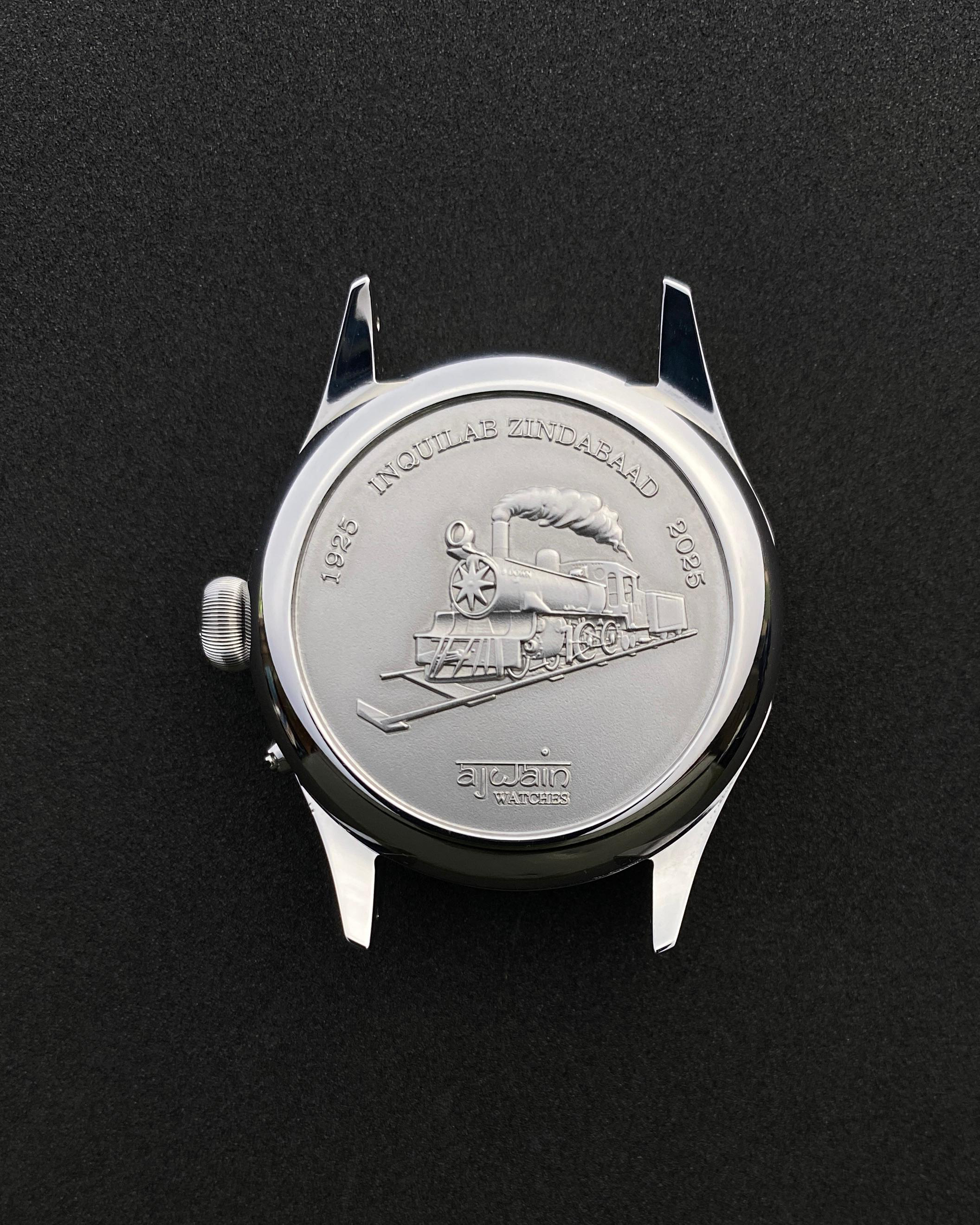 Watch case with embossed design on a black background