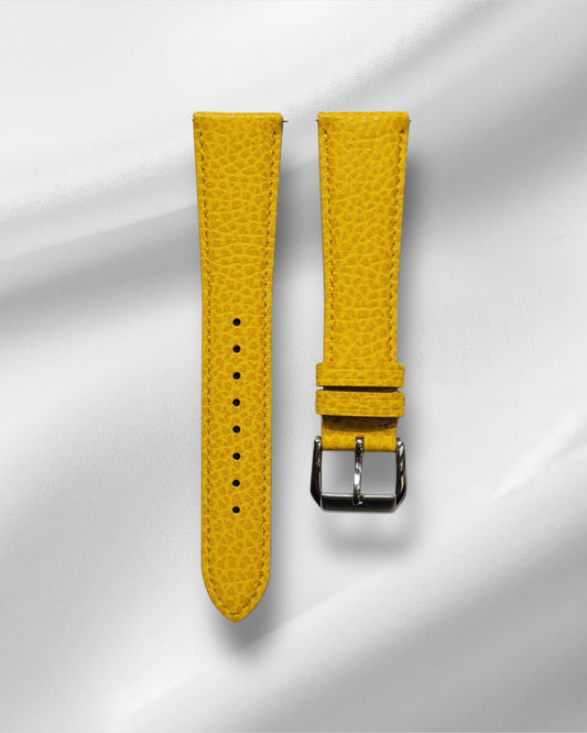 Yellow grain-textured leather watch strap with distinctive surface pattern and vibrant color