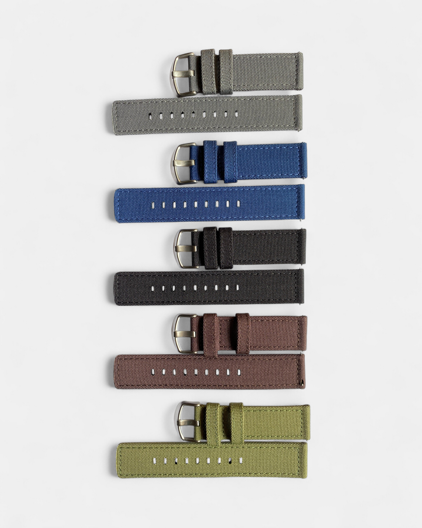 Set of six Nylon watch straps in different colors on a white background