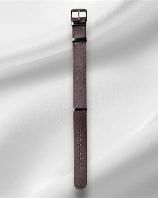 Brown watch strap with silver buckle on a white background